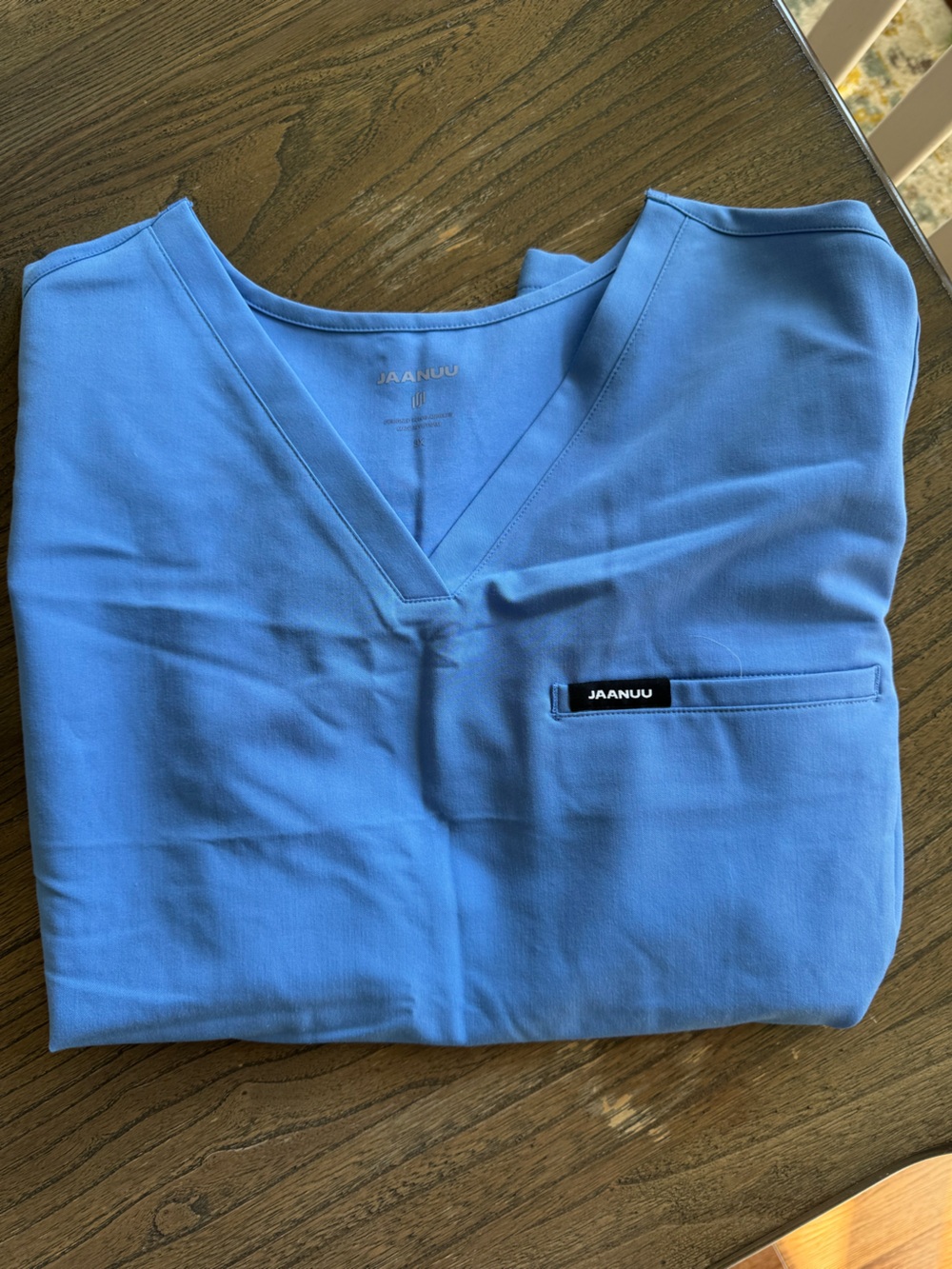 Jaanuu Woman’s Scrub Set — V-Neck Scrub Top and Jogger Bottoms in Light Blue
